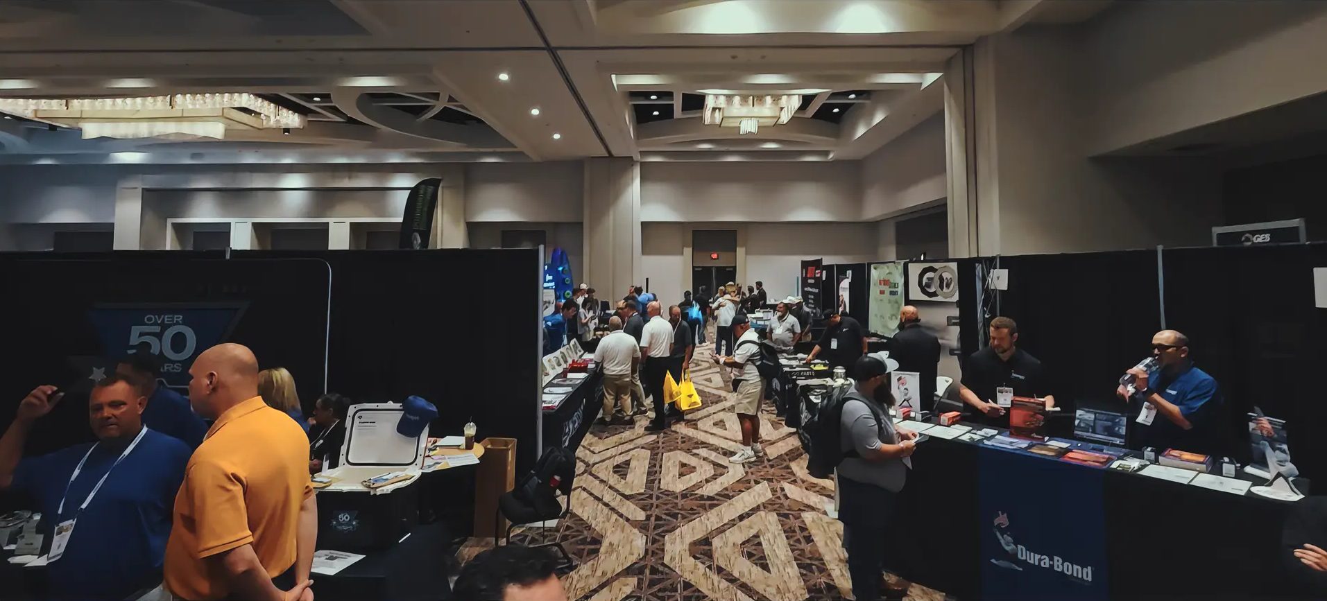 Exhibitors and visitors along a previous Powertrain Expo show aisle
