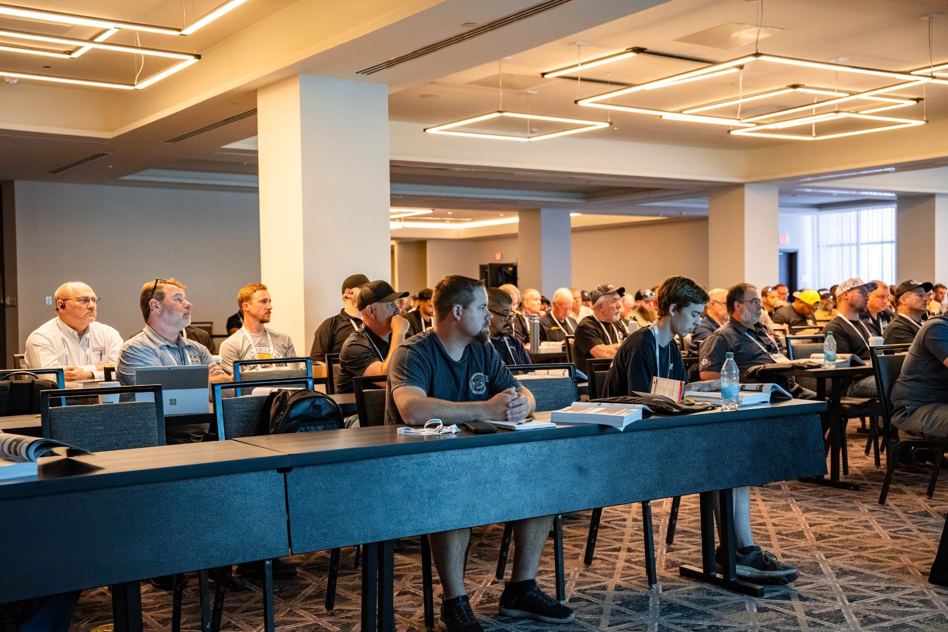 Attendees taking notes during a previous Powertrain Expo seminar
