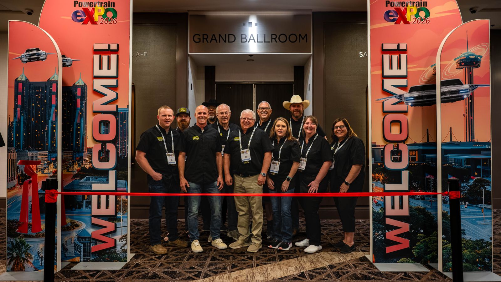 Ribbon cutting at the trade show entrance during a previous Powertrain Expo
