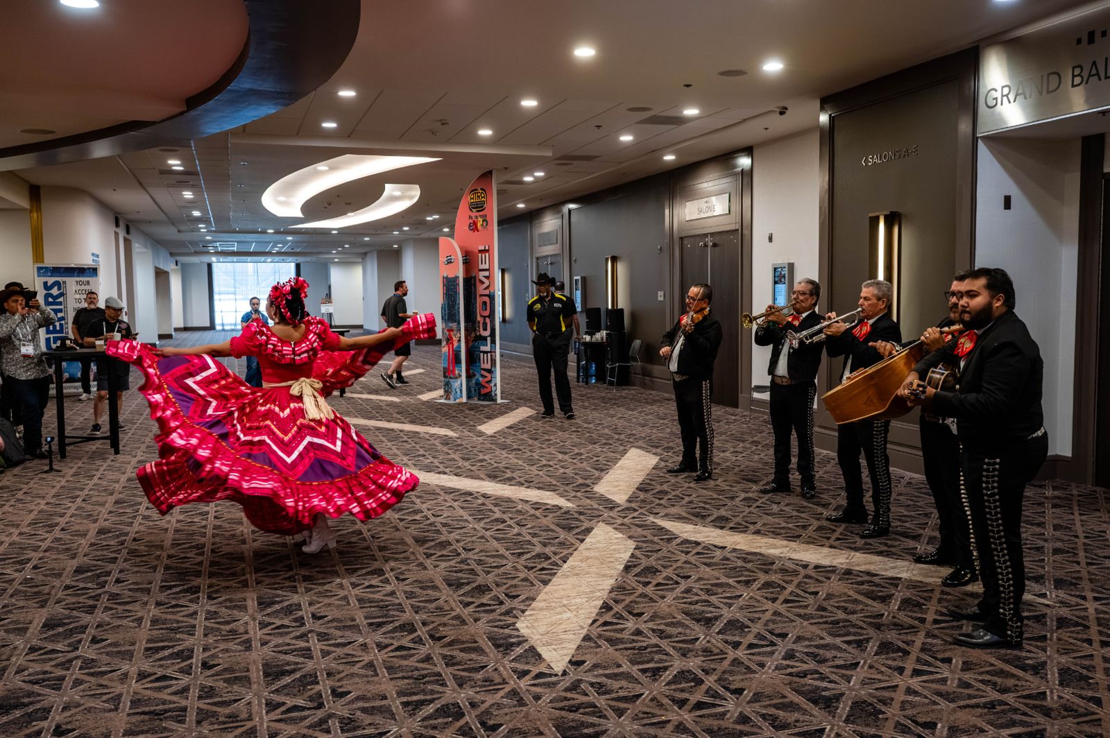 Folklórico dancer and mariachi musicians performing at a previous Powertrain Expo event